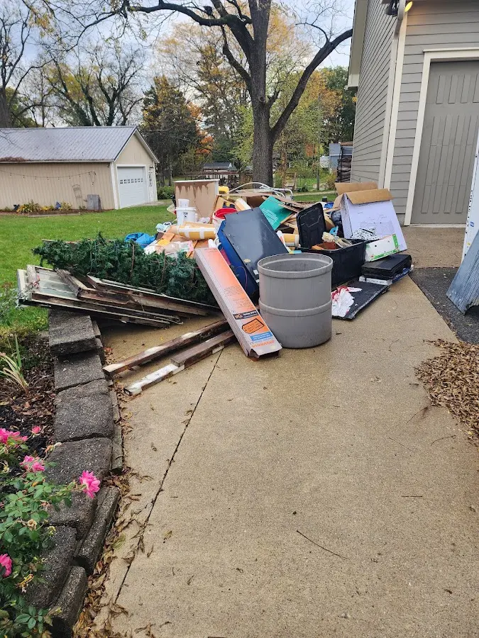 Dumpster being loaded with debris for Commercial Dumpster Rental in White Settlement